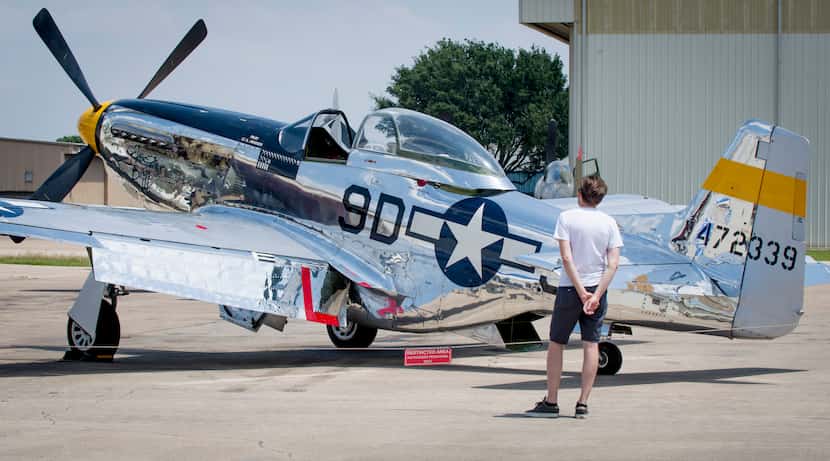 A visitor to the Warbirds Over Addison event at the Cavanaugh Flight Museum checks out the...