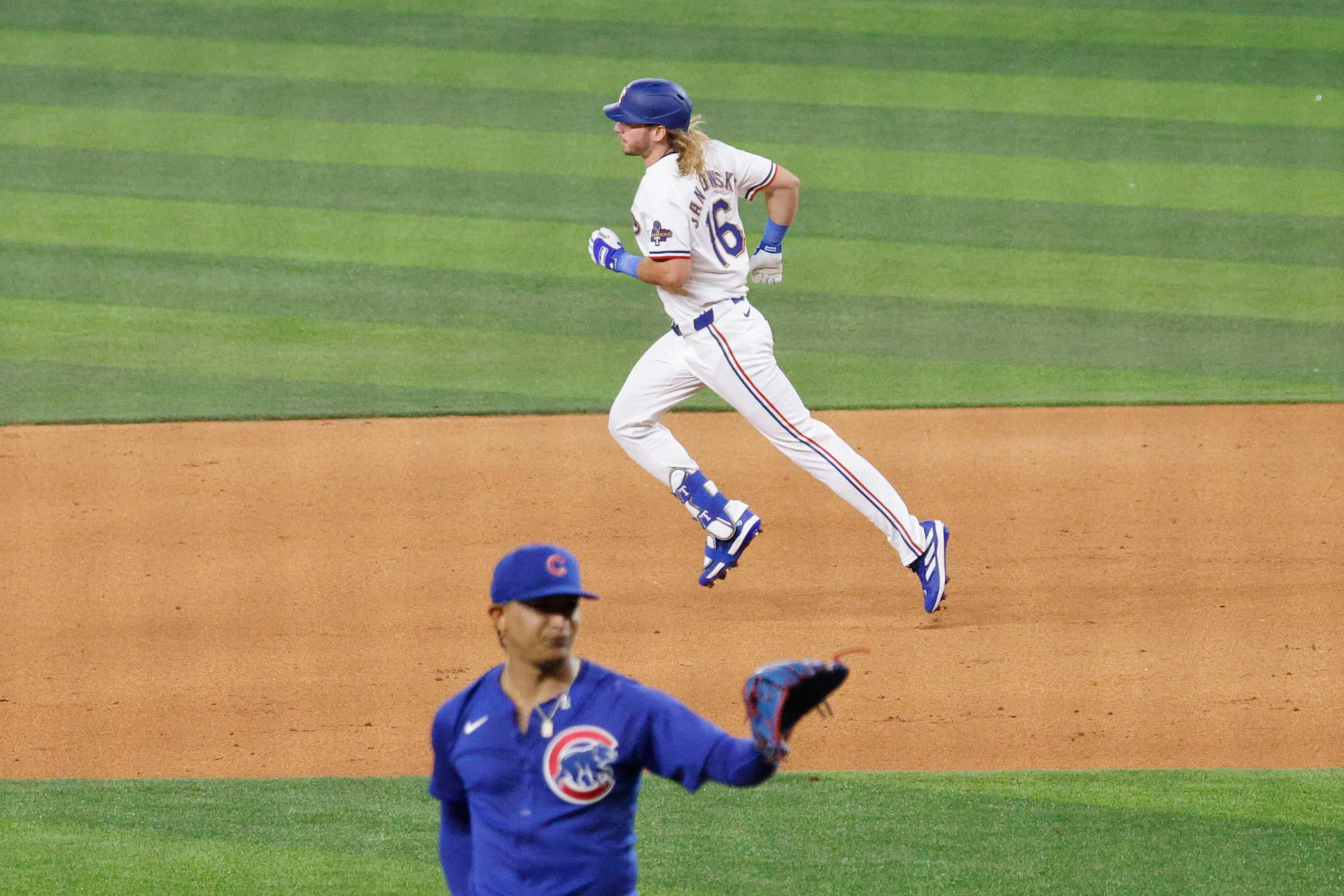 Texas Rangers left fielder Travis Jankowski (16) runs the bases after hitting a home run...