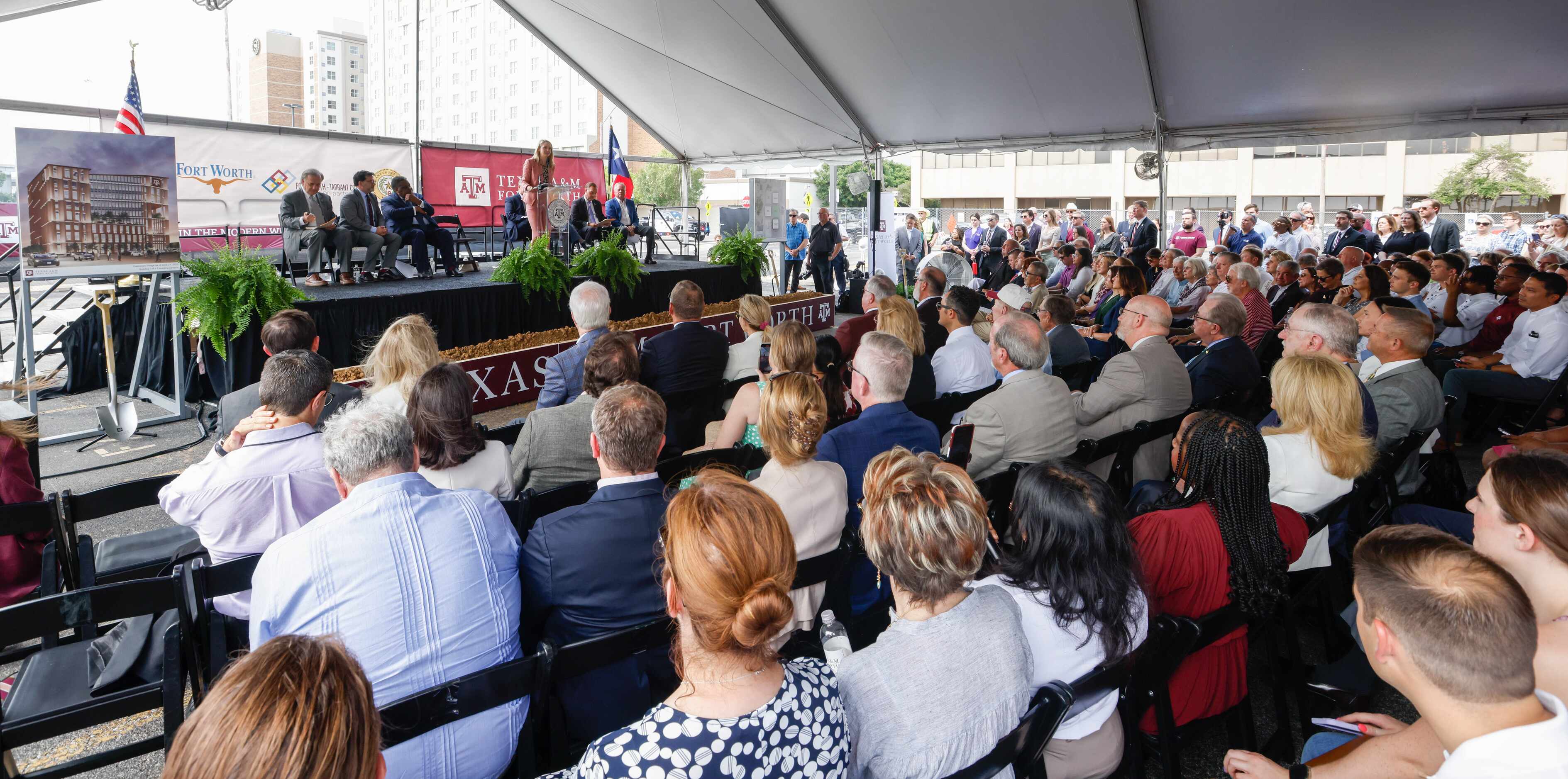 A crowd of hundreds gather under a tent for a groundbreaking ceremony for Texas A&M-Fort...