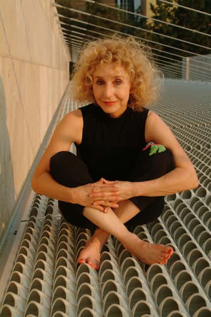 Andrea Nasher sitting on the roof of the Nasher Sculpture Center during construction. (Marc...