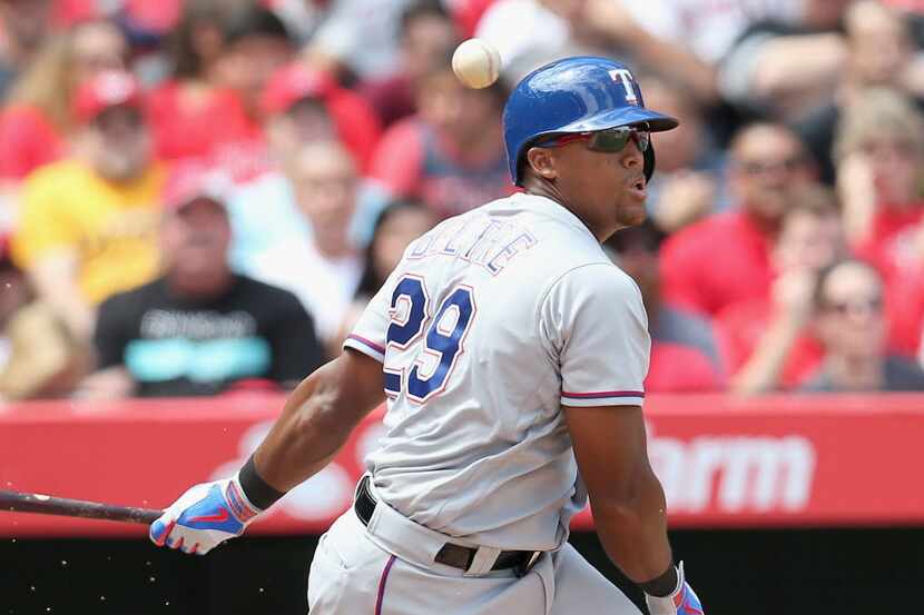ANAHEIM, CALIFORNIA - APRIL 10:  Adrian Beltre #29 of the Texas Rangers bounces the ball in...