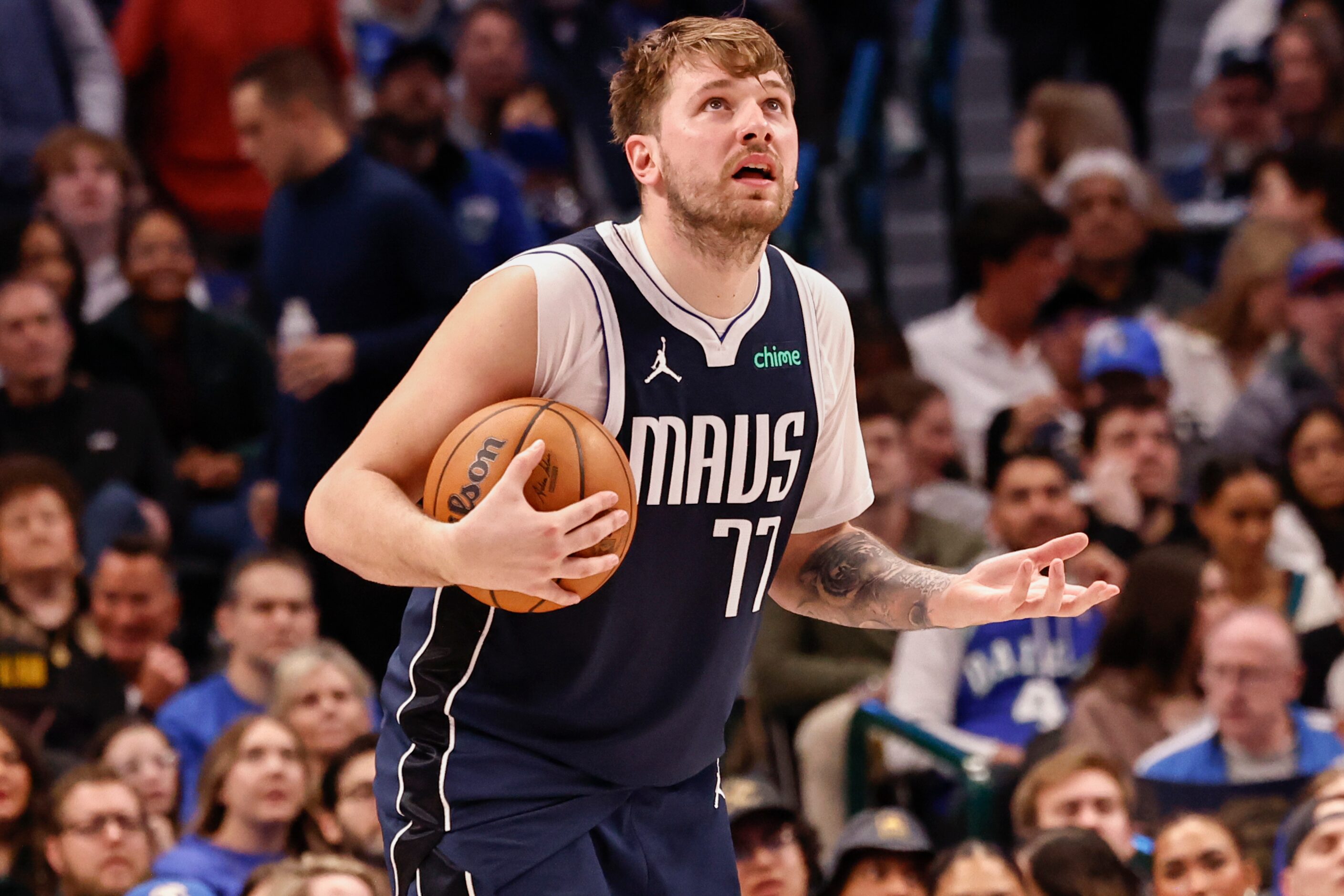 Dallas Mavericks guard Luka Dončić (77) reacts to a foul call during the first half of a NBA...