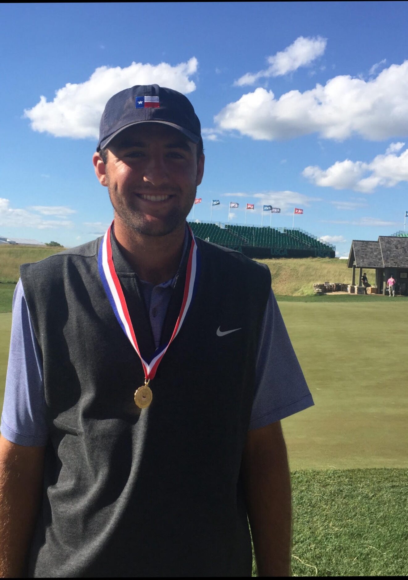 Scottie Scheffler wears with his low amateur medal earned at the U.S. Open.