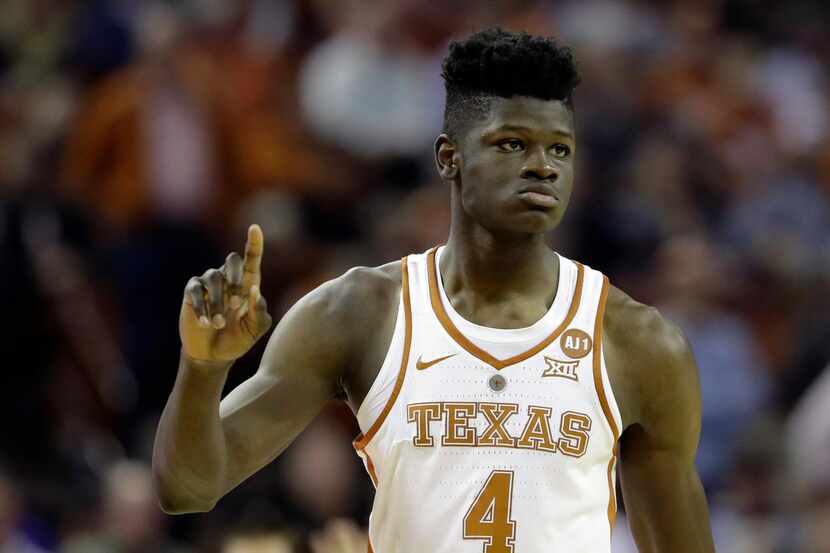 FILE - In this Feb. 7, 2018, file photo, Texas forward Mohamed Bamba (4) gestures during the...