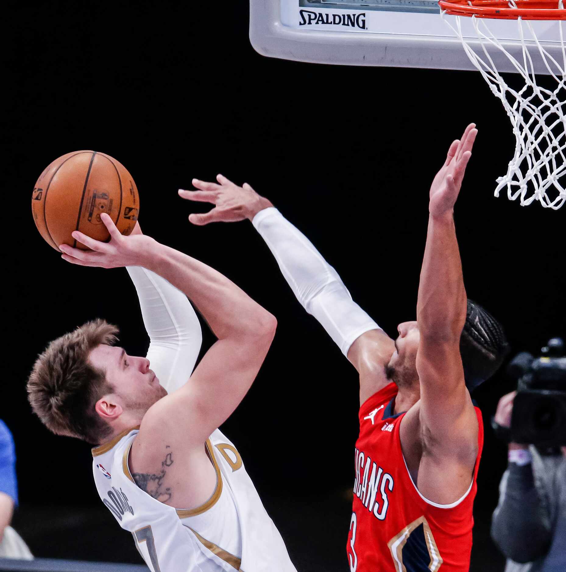 Dallas Mavericks guard Luka Doncic (77) attempts a shot as New Orleans Pelicans guard Josh...