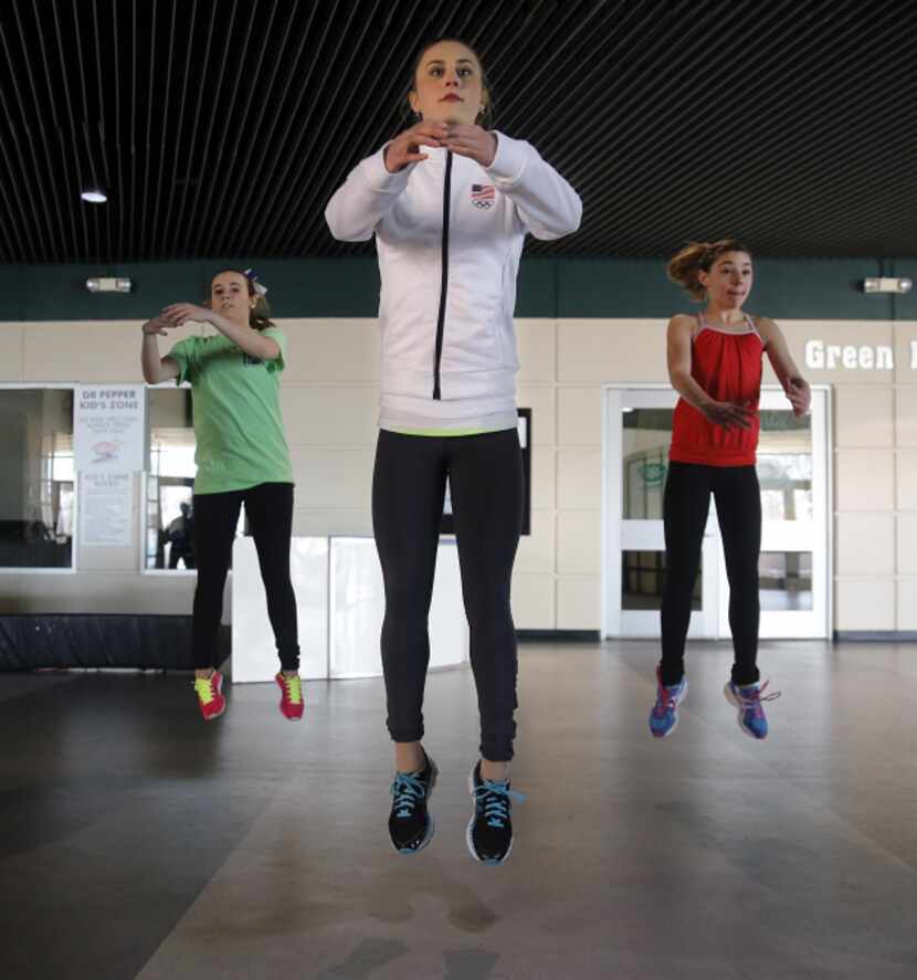 Team USA figure skater Ashley Cain works out by doing leaps during her father/coach, Peter...