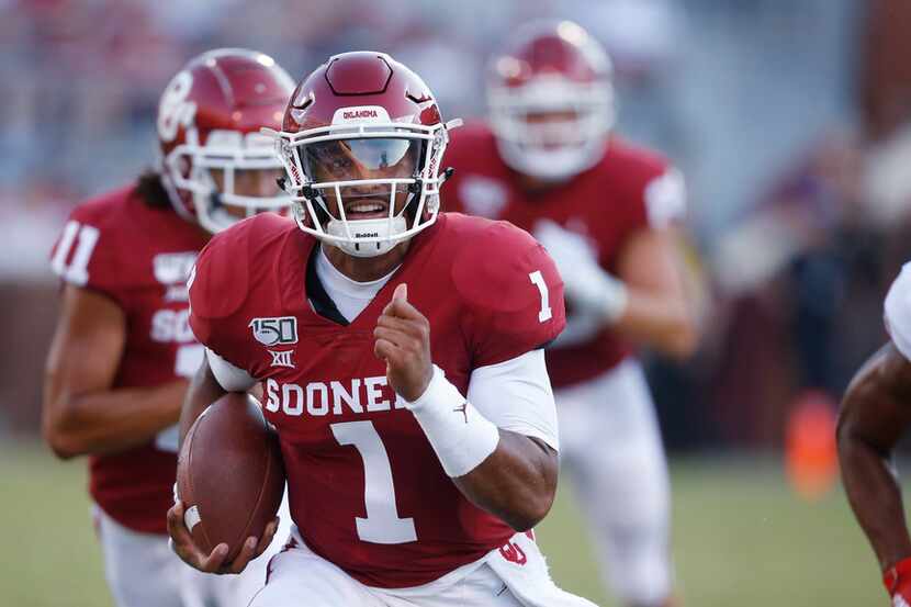 Oklahoma quarterback Jalen Hurts (1) carries in the second quarter of an NCAA college...