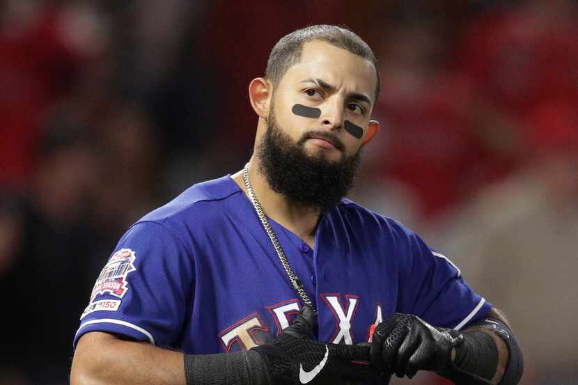 Texas Rangers' Rougned Odor reacts after striking out in the fifth inning of the team's...