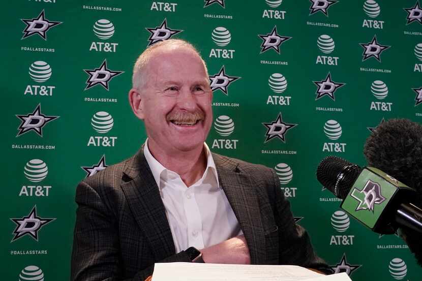 Dallas Stars manager Jim Nill smiles before speaking to reporters during a news conference...