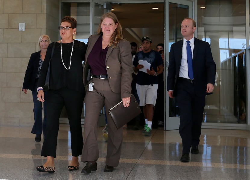 Christina Morris' mom, Jonni McElroy, walks into the lobby of the courthouse with Robyn...