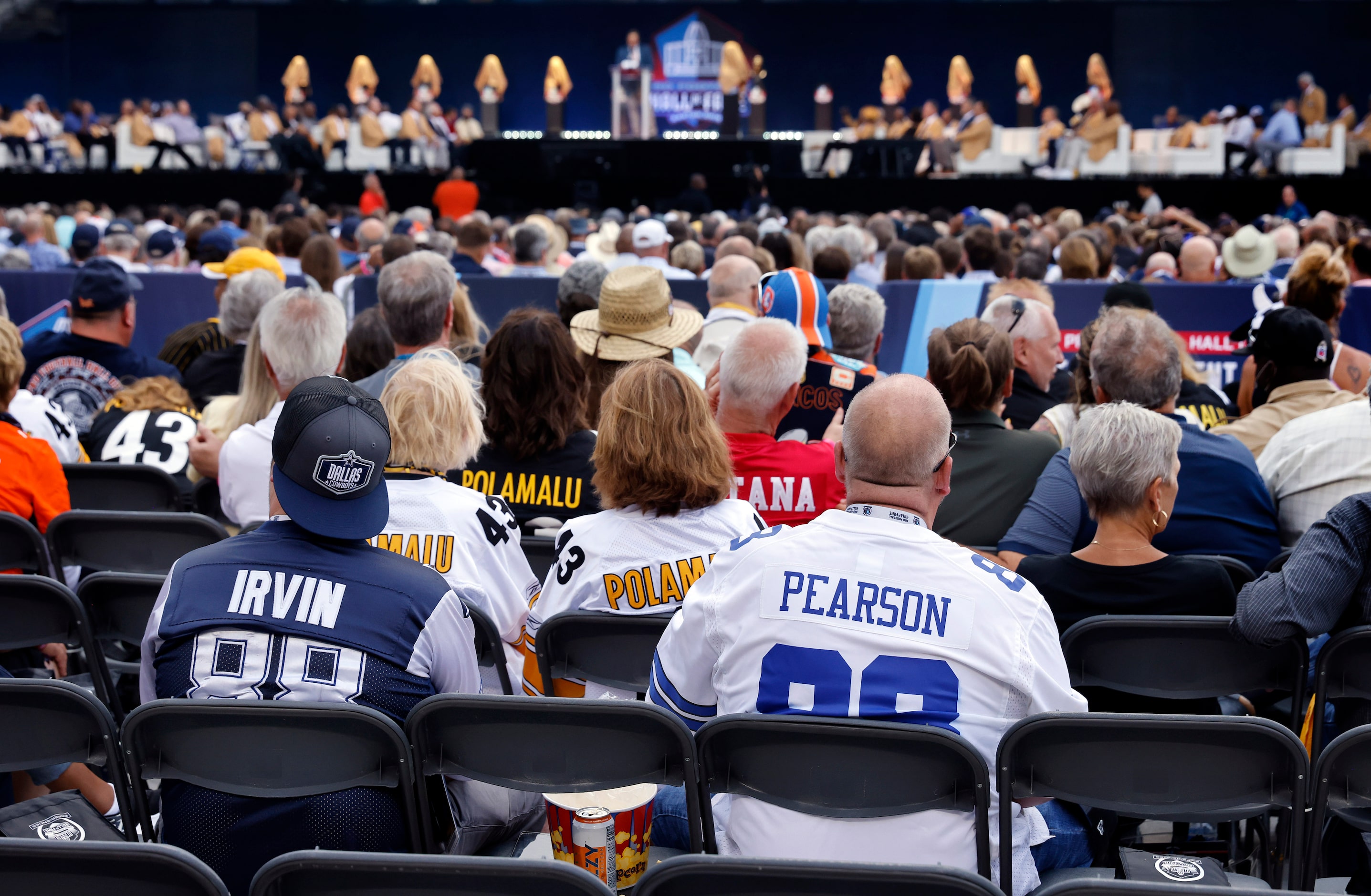 Dallas Cowboys fans wait for Pro Football Hall of Fame inductee Cliff Harris of the Cowboys...