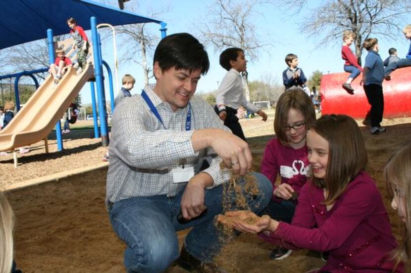Ross Miller, a member of the Lower School Dads Club plays with his third-grade daughter Ella...