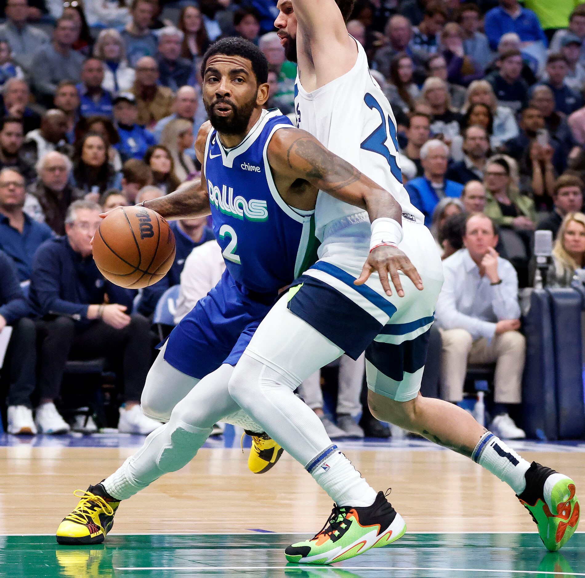 Dallas Mavericks guard Kyrie Irving (2) tries to get around Minnesota Timberwolves guard...