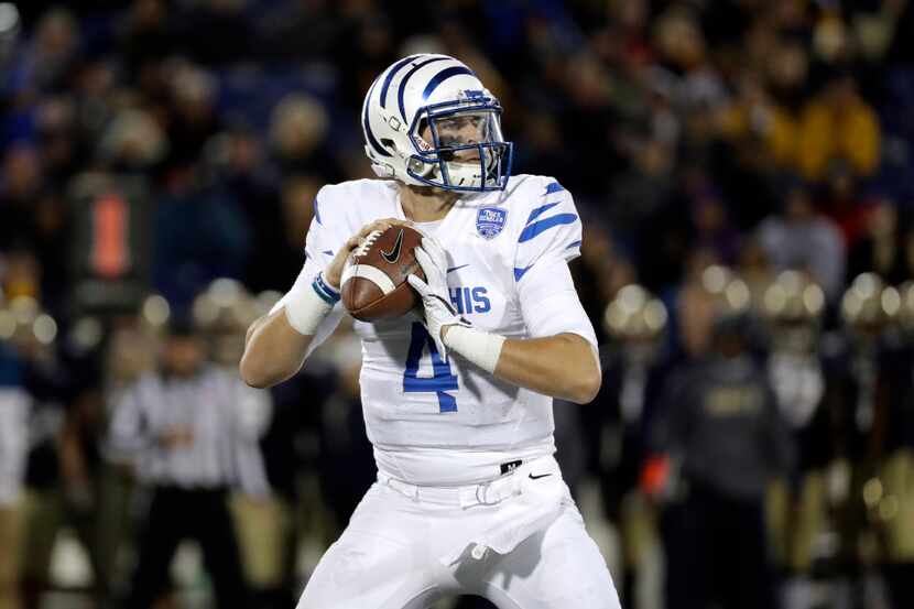 Memphis quarterback Riley Ferguson looks for a receiver in the second half of an NCAA...