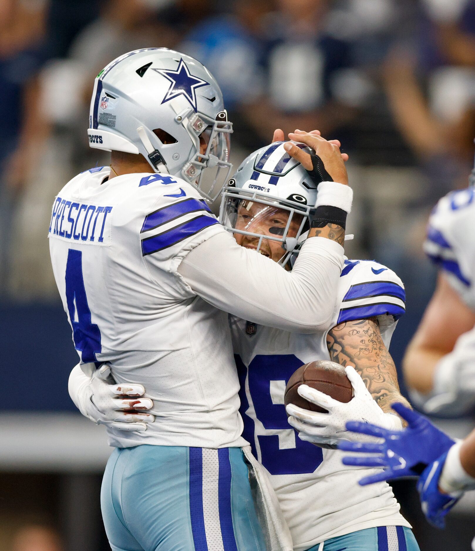 Dallas Cowboys quarterback Dak Prescott (4) celebrates a touchdown with tight end Peyton...