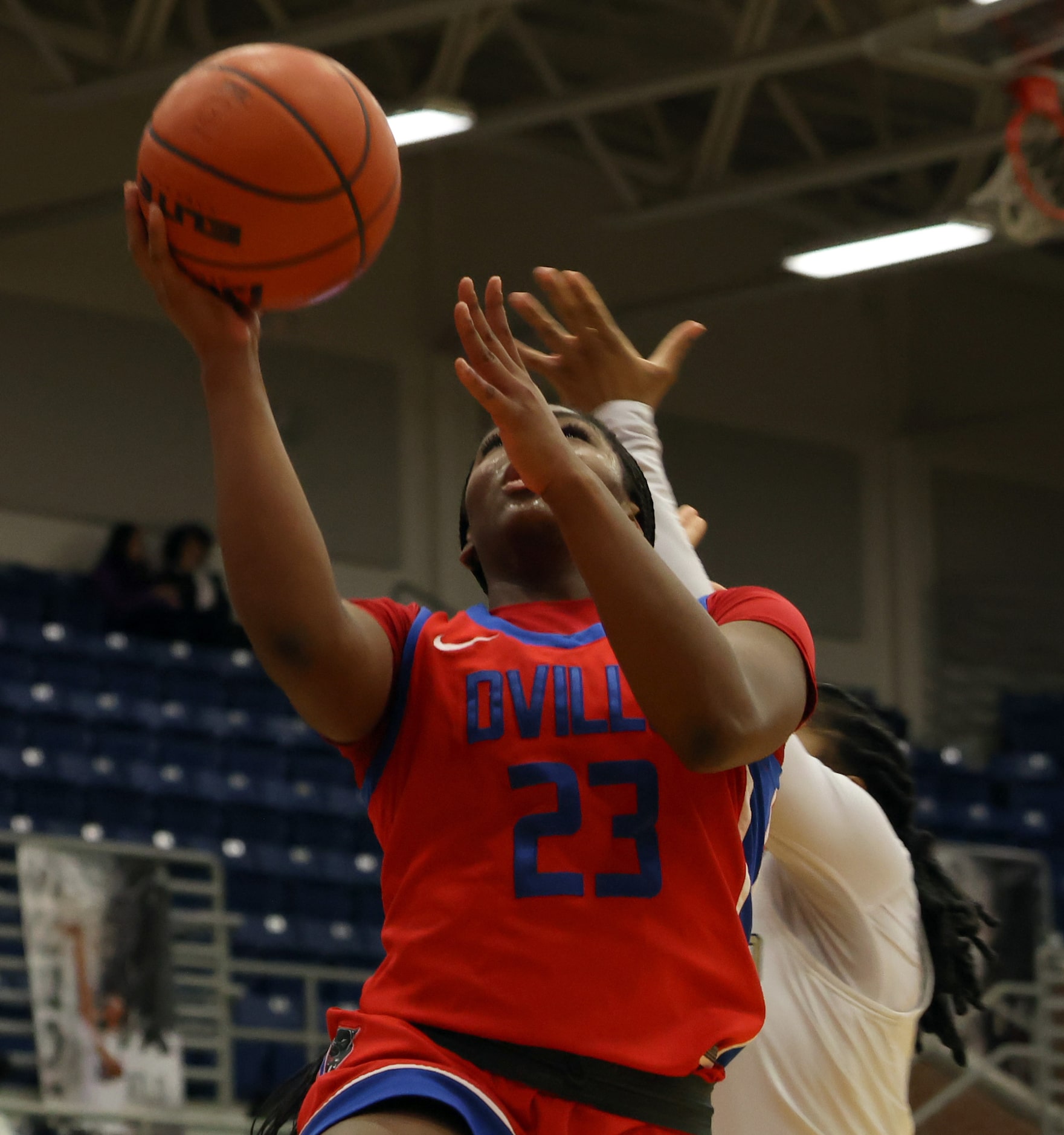 Duncanville guard Trystan James (23) scores in front of a Mansfield defender on a first half...