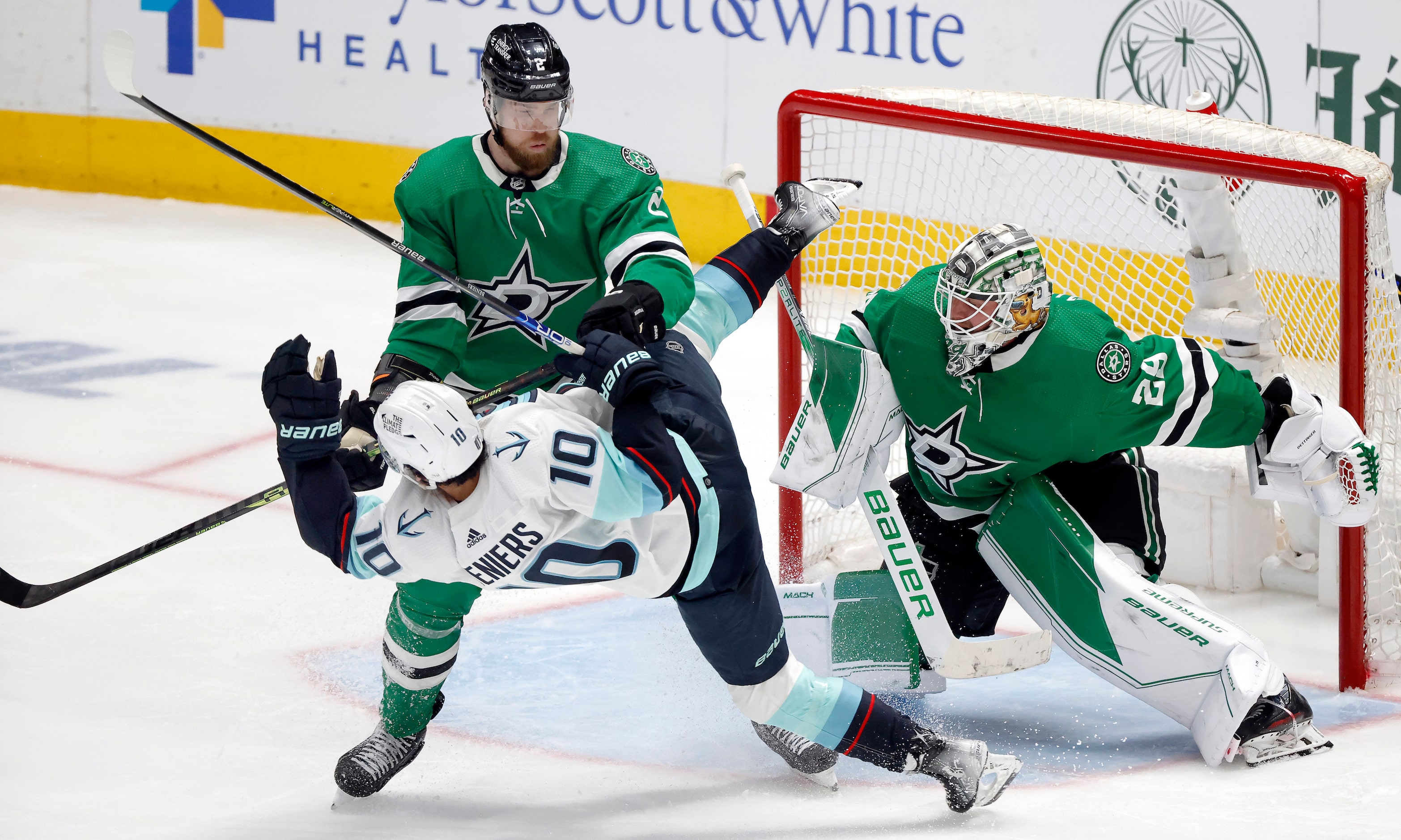 Dallas Stars defenseman Jani Hakanpää (2) takes down Seattle Kraken center Matty Beniers...