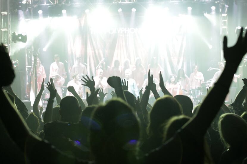 Fans cheer as The Polyphonic Spree performs at Granada Theater in Dallas, TX, on Oct. 17,...