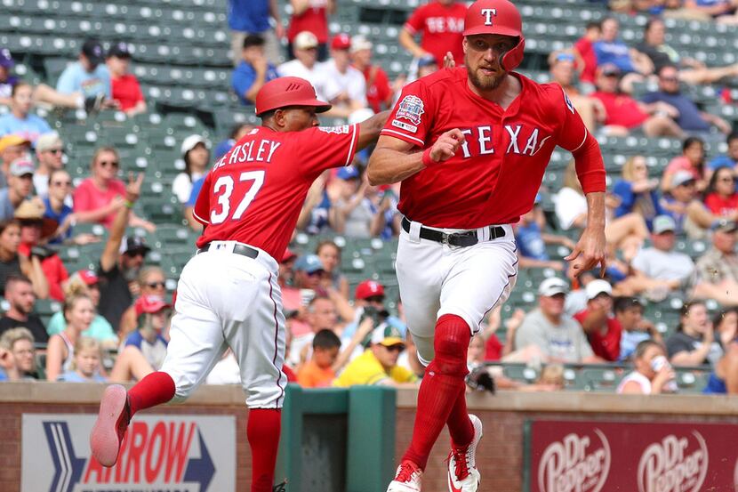Texas Rangers' Hunter Pence (24) runs home to score on a double by Asdrubal Cabrera in the...