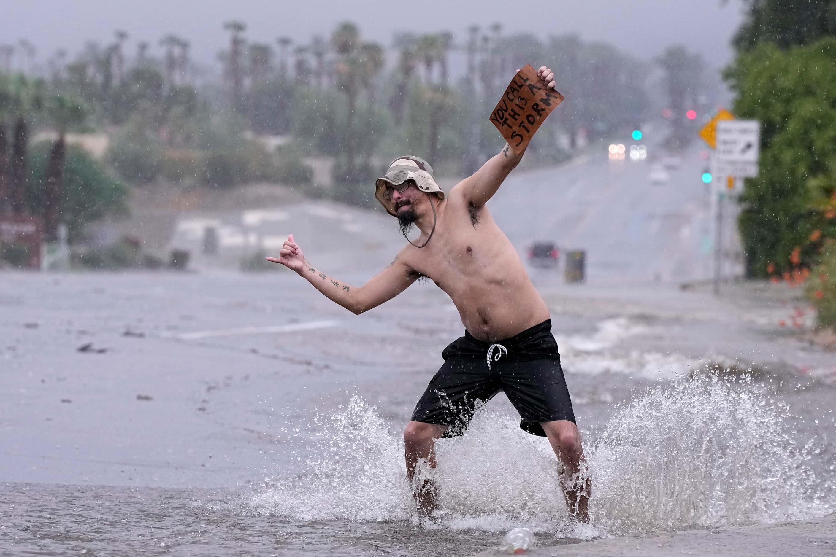 Joseph Wolensky stands in the street with a sign that says "You call this a storm?" Sunday,...