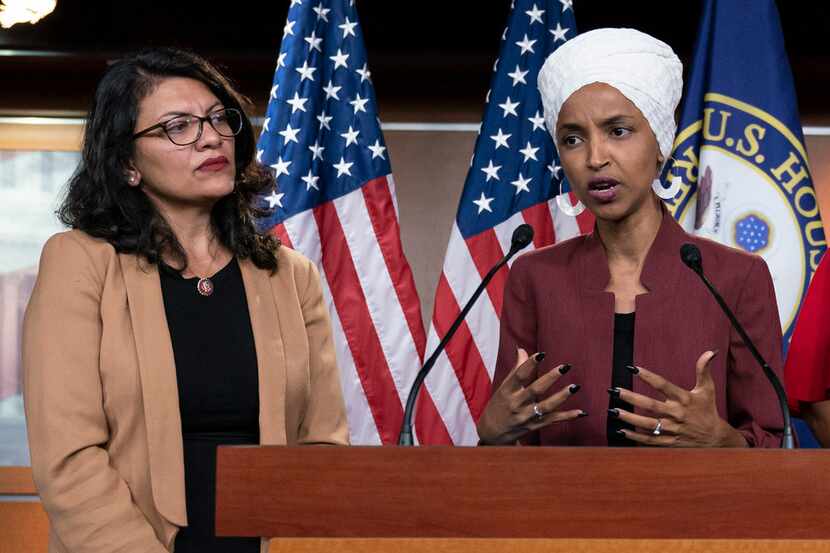 FILE - In this July 15, 2019, file photo, U.S. Rep. Ilhan Omar, D-Minn, right, speaks, as...