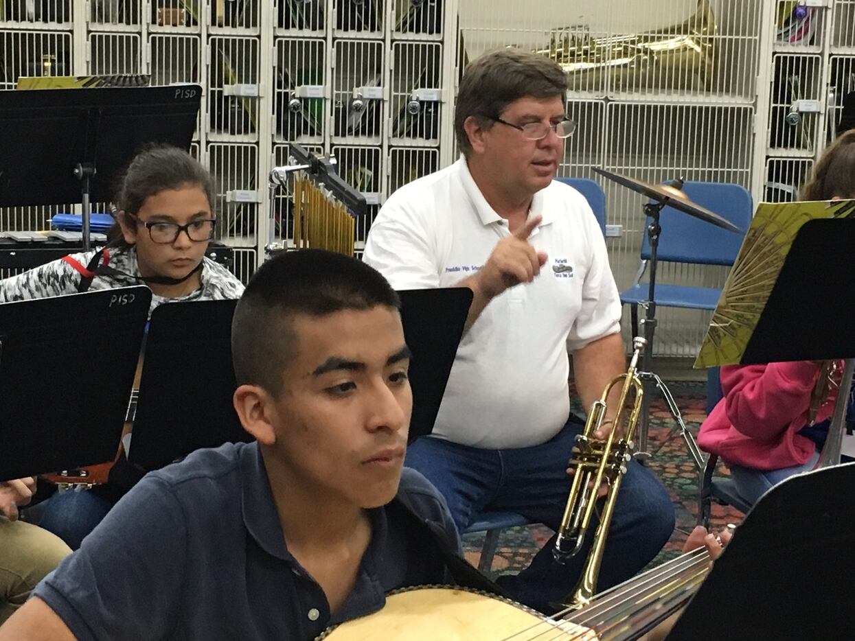 John Ferguson leads students during mariachi band practice.  He serves as the middle school...