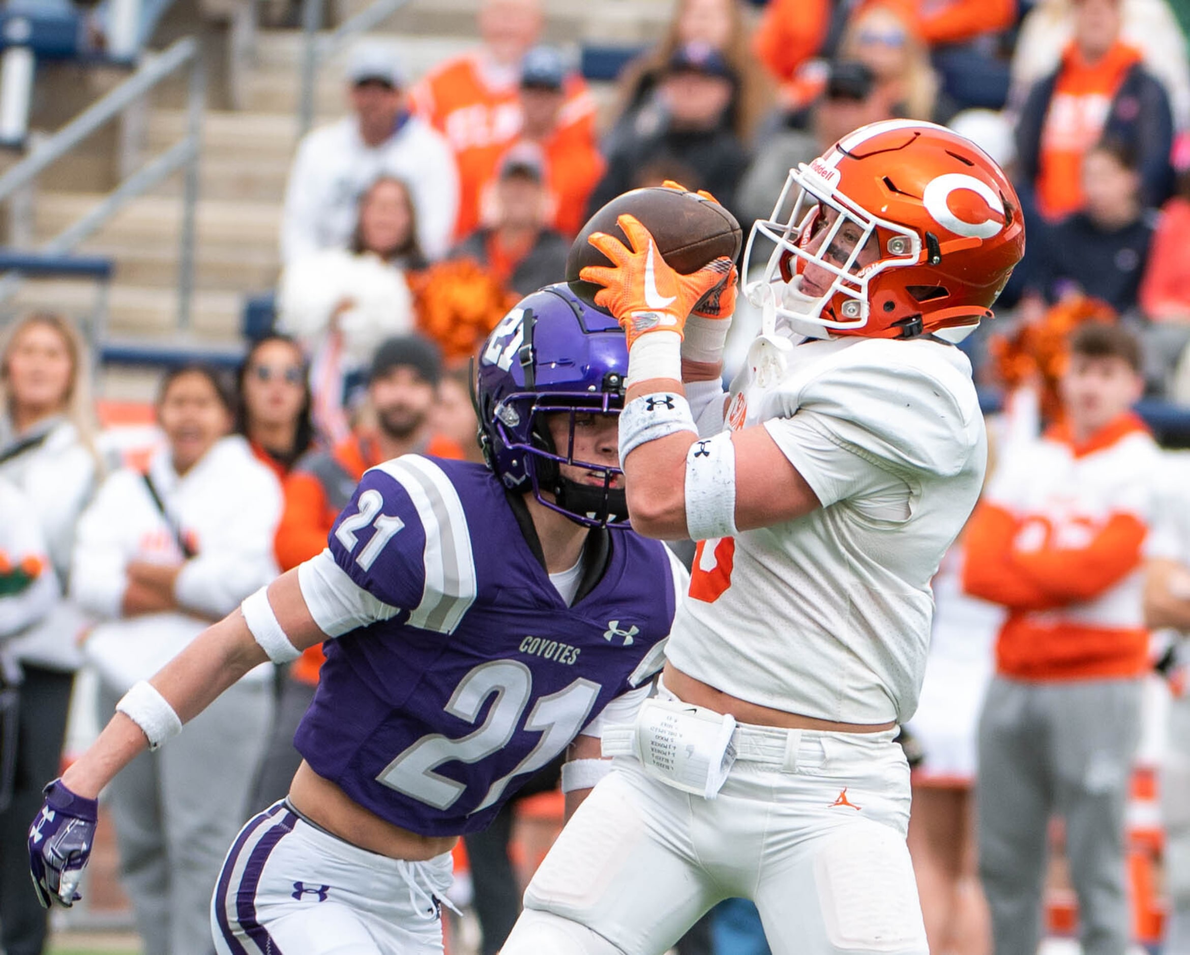 Celina's Collin McKiddy (8) catches a pass in front of Anna free safety Roman Frazier (21)...