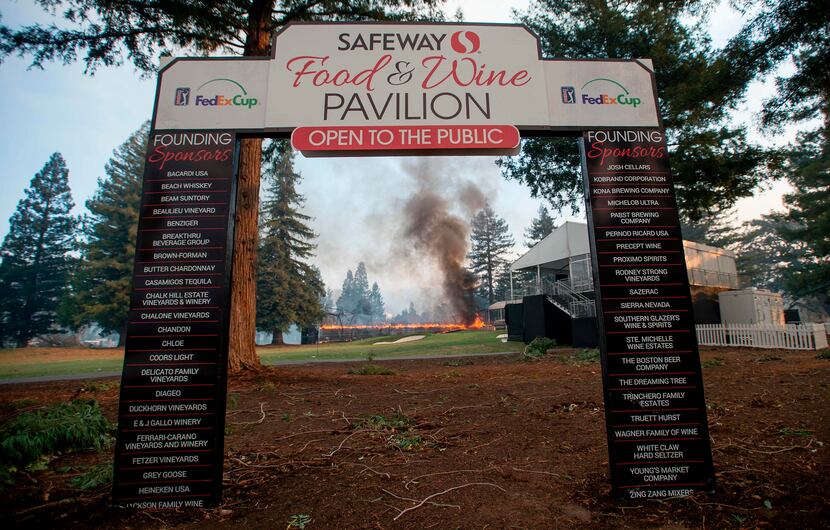 A tent structure built for the 2017 Safeway Open burns on a golf course at the Silverado...