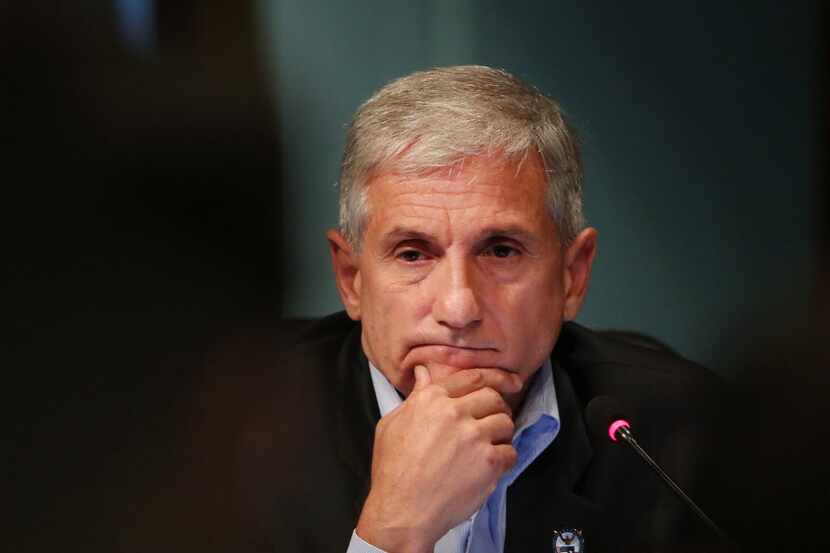 DISD trustee Dan Micciche, of District 3, listens to speakers during a special meeting by...