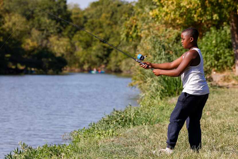 P2 Williams, 10, casts his bait into White Rock Lake on Aug. 13.