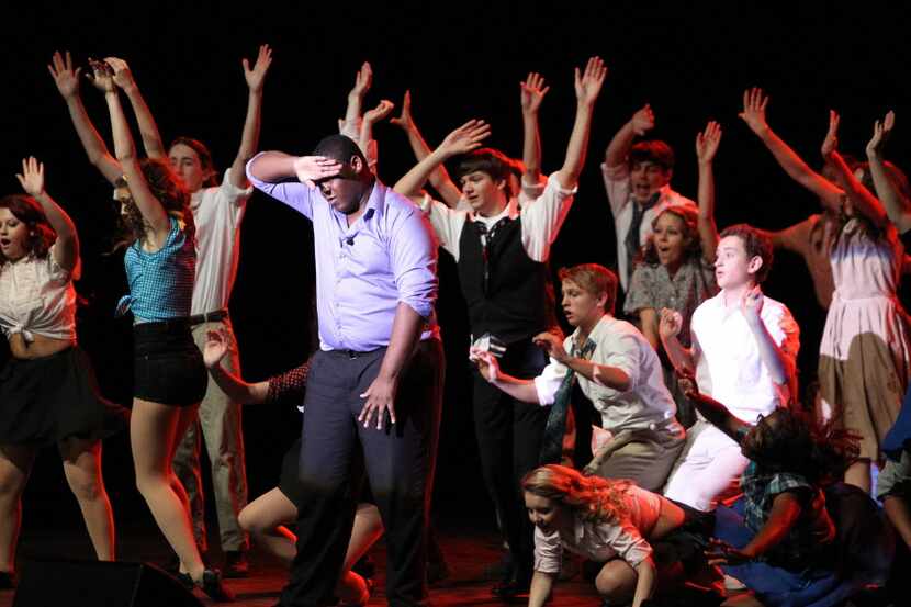 Waxahachie High School students perform "Too Darn Hot" from Kiss Me Kate during before the...