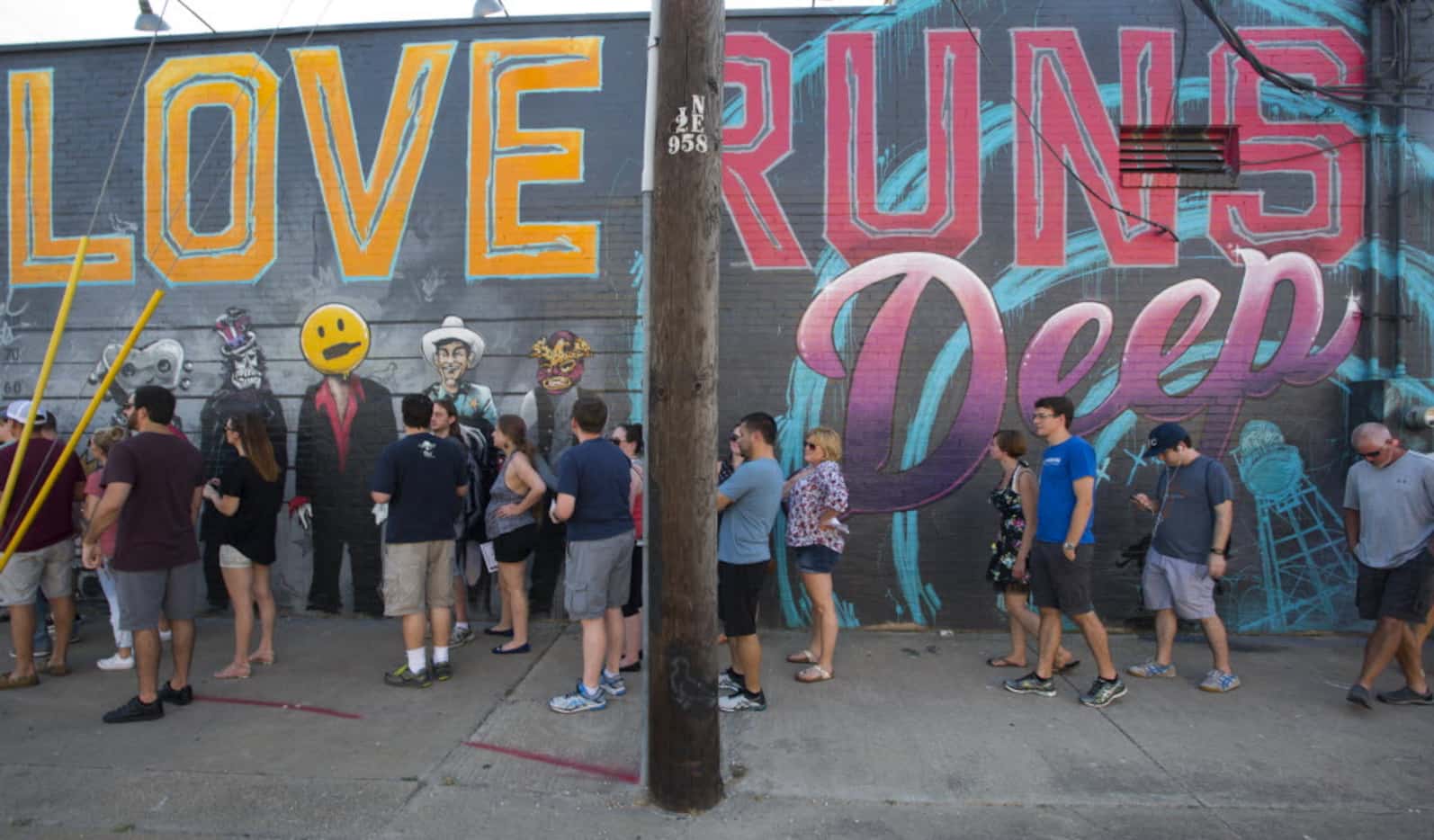 Home brew fans line up outside Deep Ellum Home Brewing Company to gain admission to the...