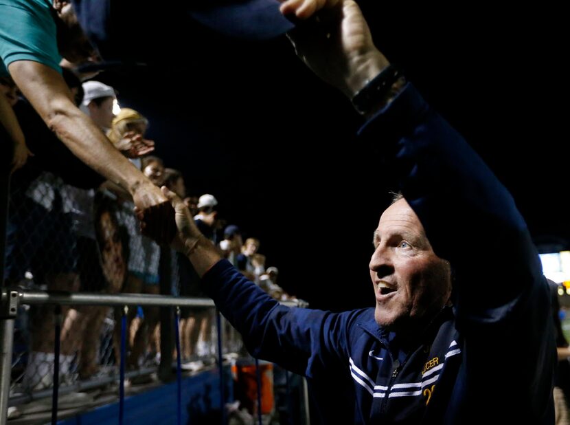 Jesuit head coach Charles DeLong shakes hands with fans after a 2-1 win over Arlington Sam...