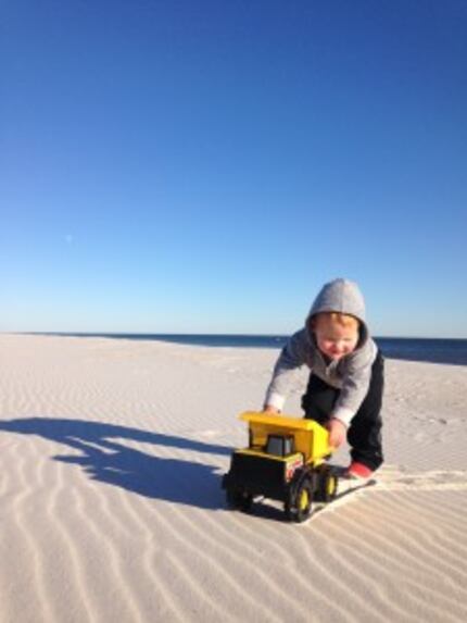  Chapel Kendrick plays on the beach during his family's yearlong road trip around the country.