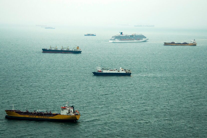 Dozens of ships sit idle off the coast of Galveston, Texas on Sunday, March 23, 2014. At...