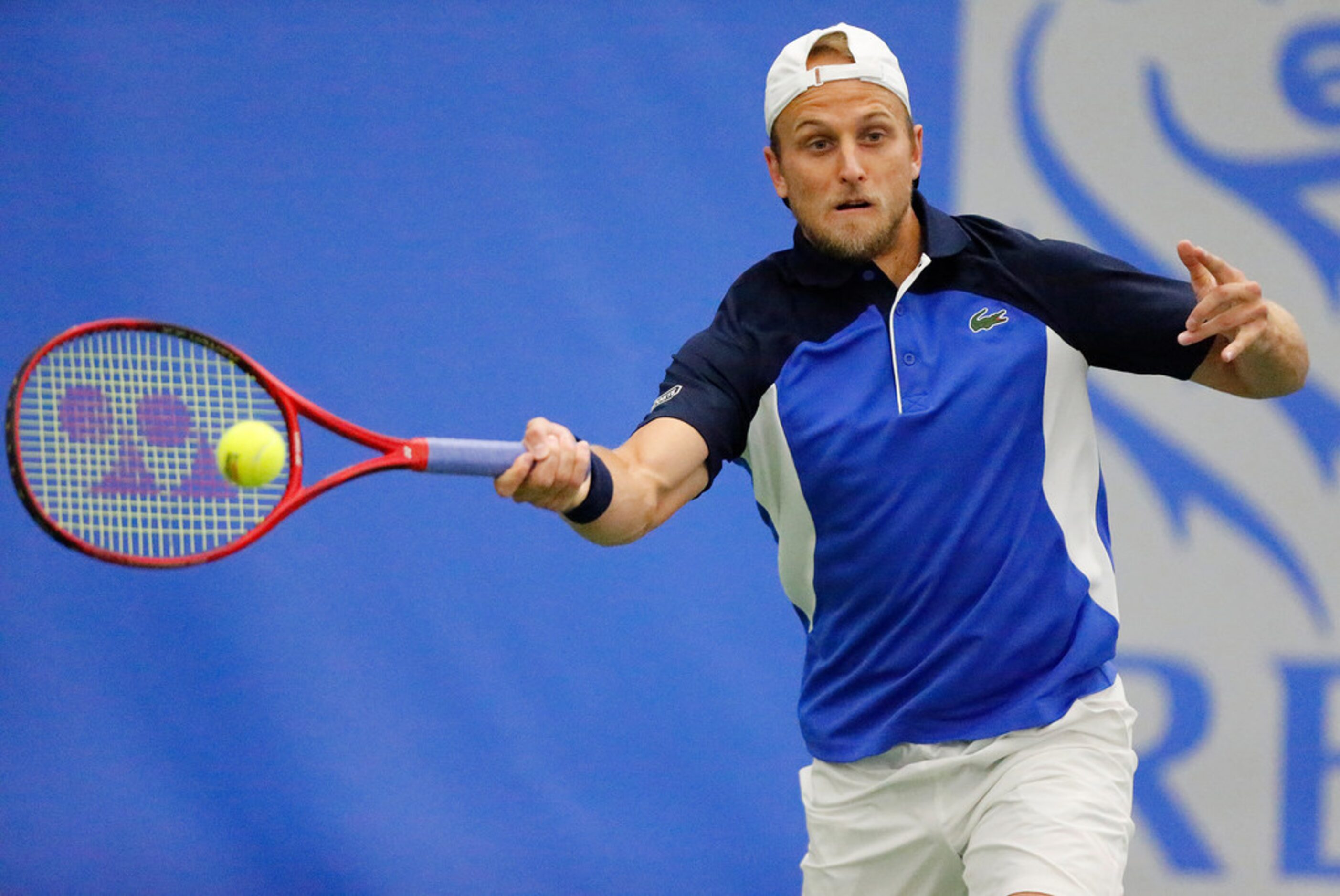 Denis Kudla uses his forehand to make a shot as he played Frances Tiafoe in a match during...