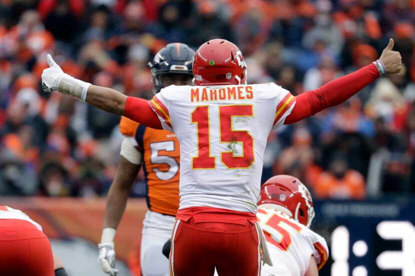 Kansas City Chiefs quarterback Patrick Mahomes (15) calls a play against the Denver Broncos...