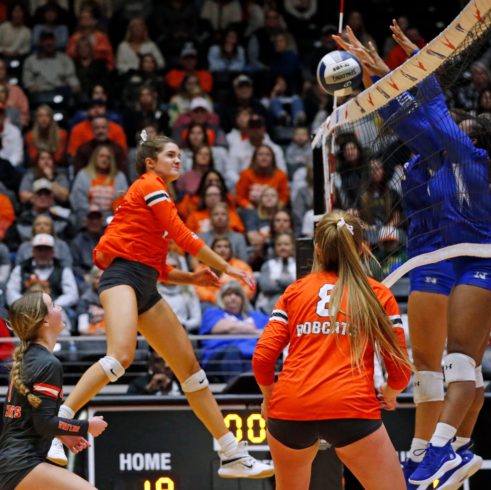 Celina's Ryan McCoy (7) drives the ball into a wall of Needville defenders during the Class...