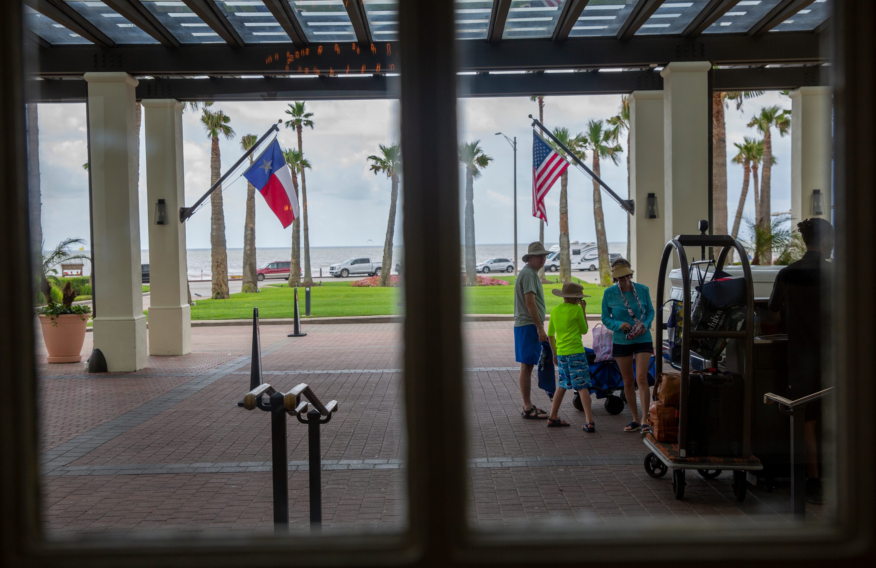 A  family arrives on July 15 at the Grand Galvez in Galveston.