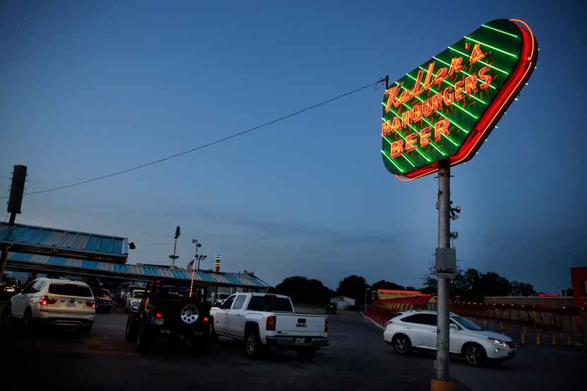 At dusk, the neon sign at Keller's Drive-In glows on Northwest Highway in Dallas,Thursday,...