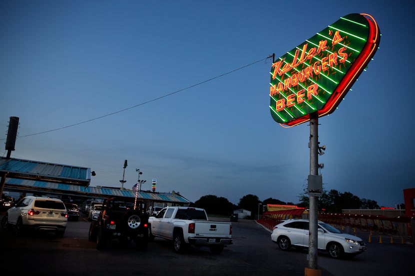 At dusk, the neon sign at Keller's Drive-In glows on Northwest Highway in Dallas,Thursday,...