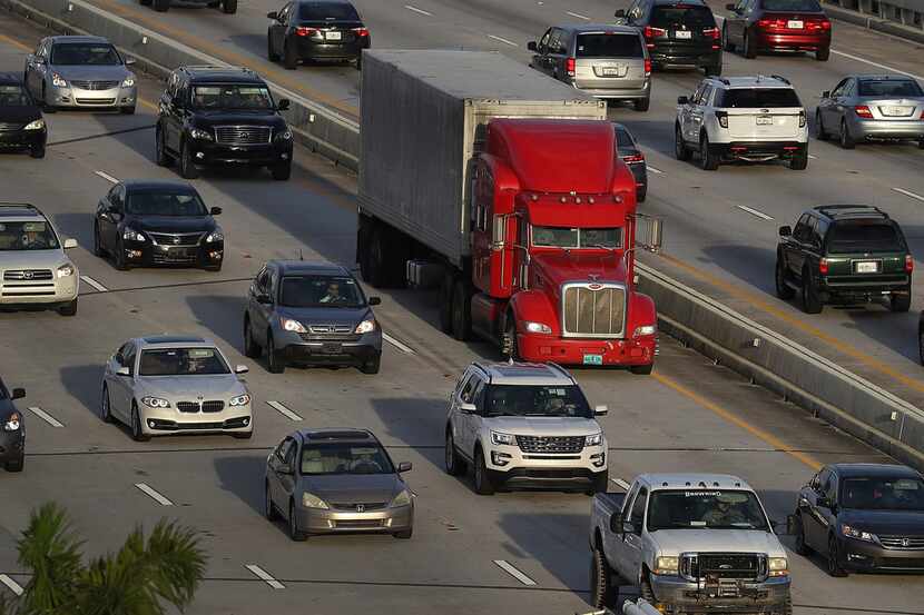 A tractor trailer rolls along the highway on November 29, 2017 in Miami, Florida.  (Photo by...