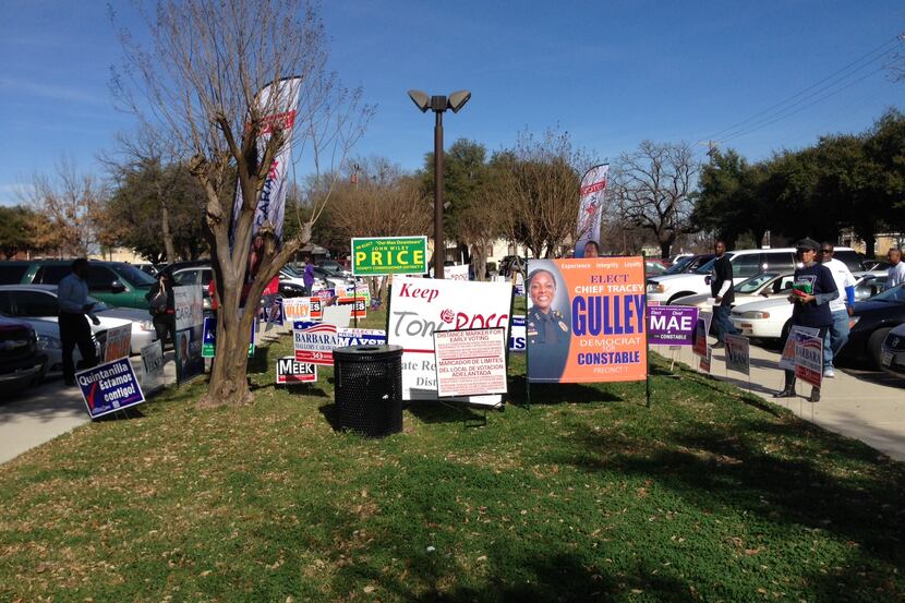  Political signs were staged at the appropriate distance away from the polling center at the...