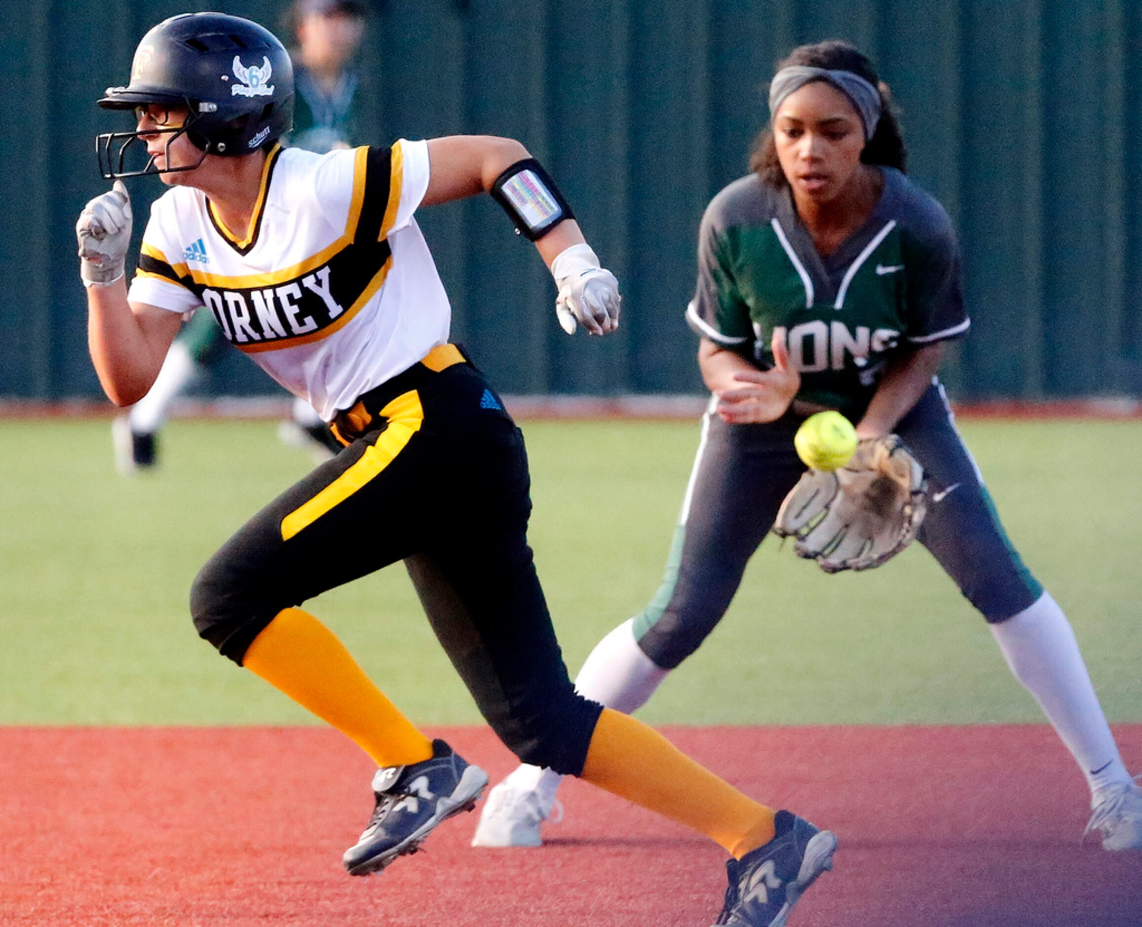 Forney High School outfielder Hannah Holdbrook (9) runs past Frisco Reedy High School...