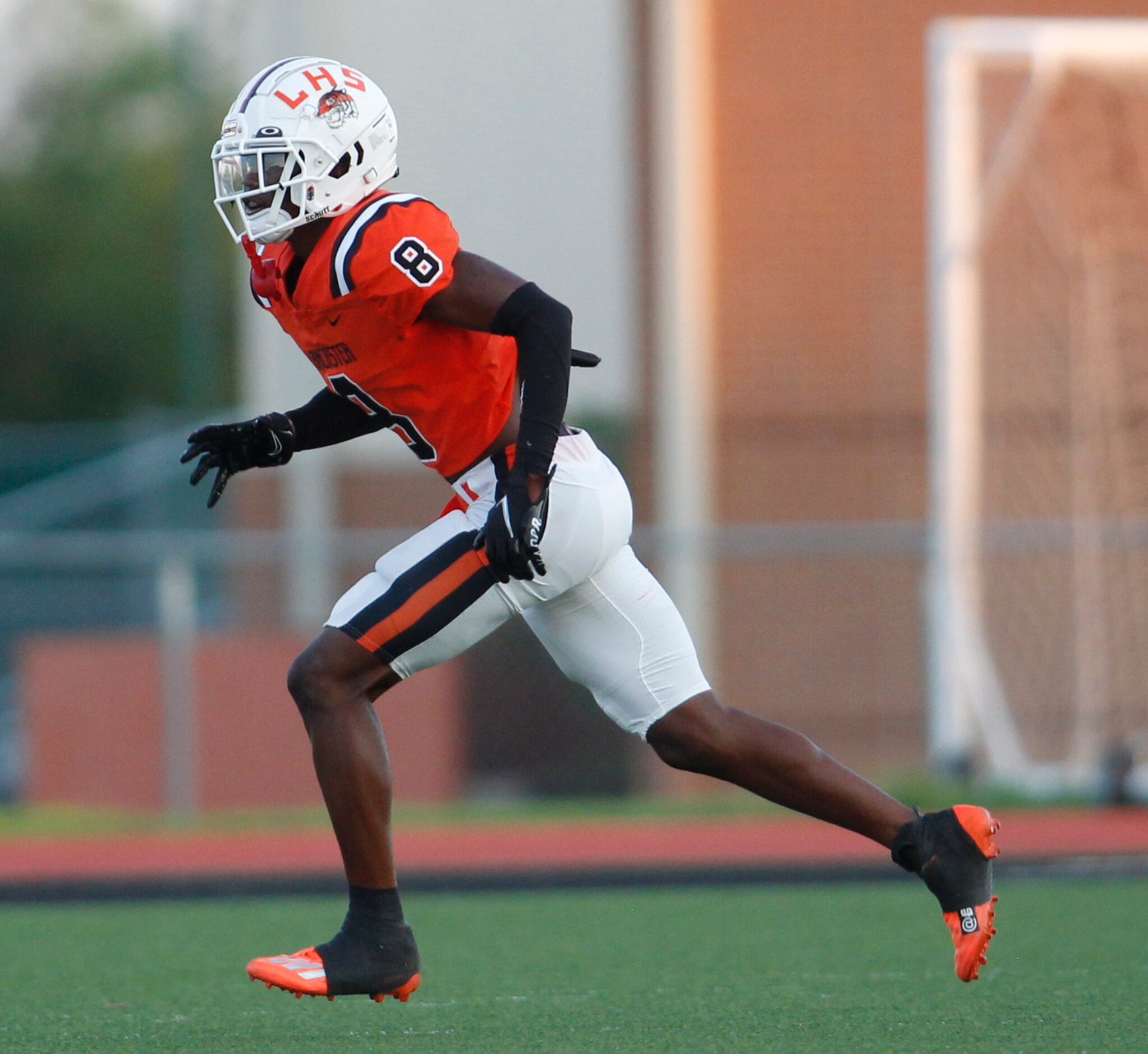 Lancaster defensive back Corian Gipson (8) drops back in coverage during a first half...