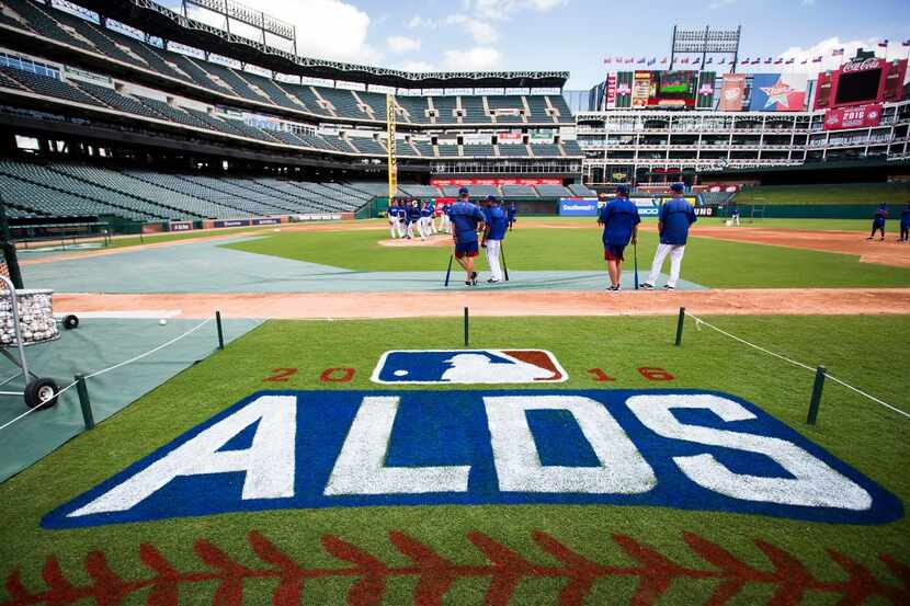 Pitchers go through a defensive drill during the Texas Rangers workout at Globe Life Park...