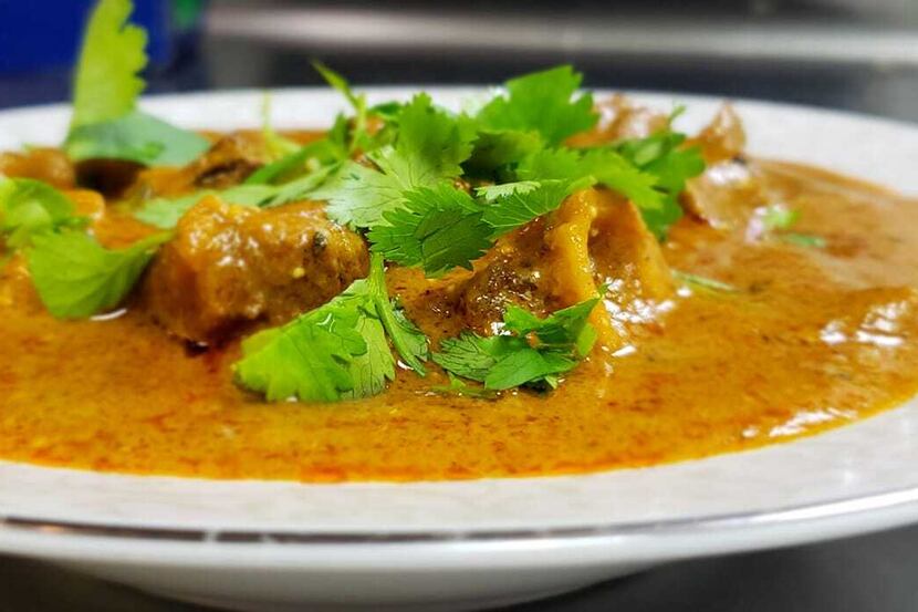 Oh My Curry sells several South Indian dishes, including spicy goat curry topped with cilantro.