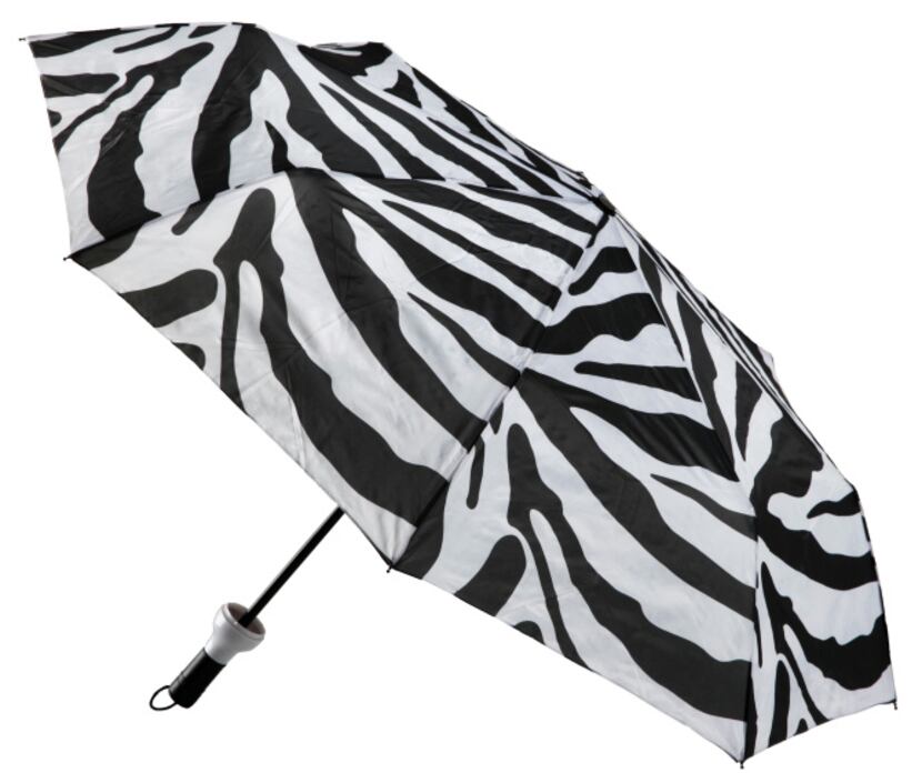 Concealed in a sleek 12-inch bottle, the Umbrella in a Bottle slides out with the first drop...