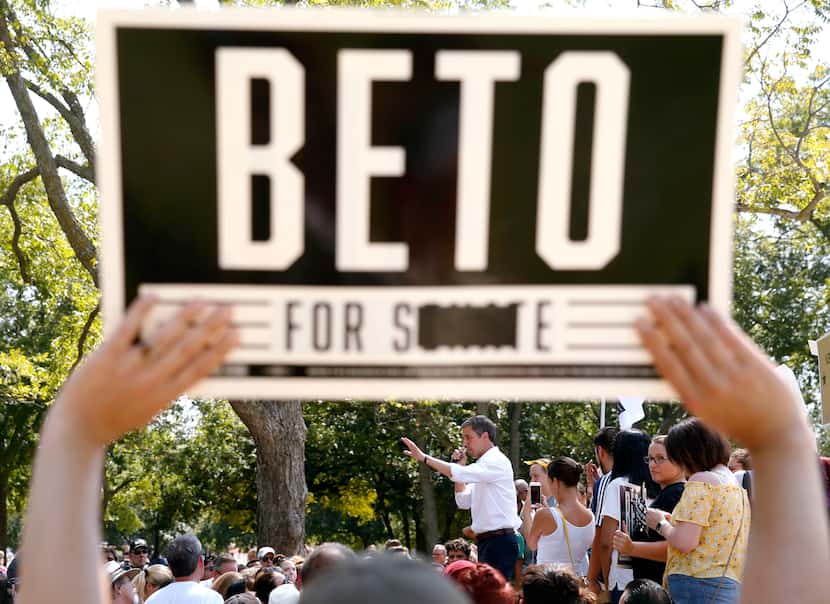 A fan holds up a sign from when Democratic Presidential candidate Beto O'Rourke previously...