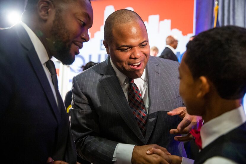 Mayor-Elect Eric Johnson Joseph Jackson Clayton, 13, as his father, Daniel Davis Clayton,...